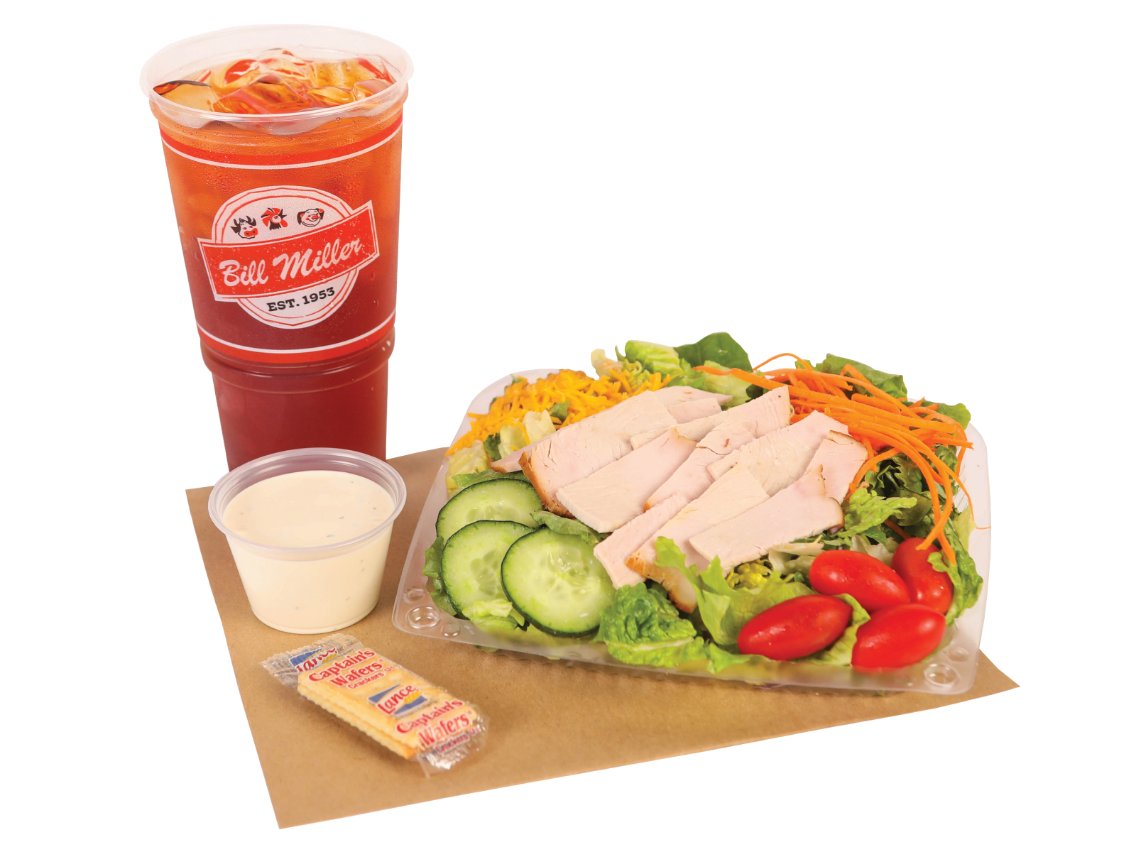 Salad Delite with turkey breast which includes, lettuce, tomatoes, crackers, cucumbers, cheese, carrots, a ranch cup, and a iced tea.
