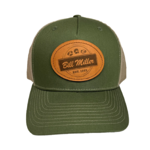 Green trucker hat with a leather patch with a Bill Miller logo
