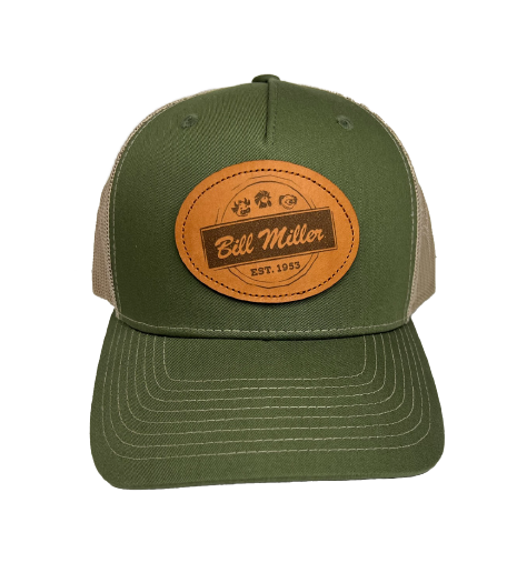 Green trucker hat with a leather patch with a Bill Miller logo